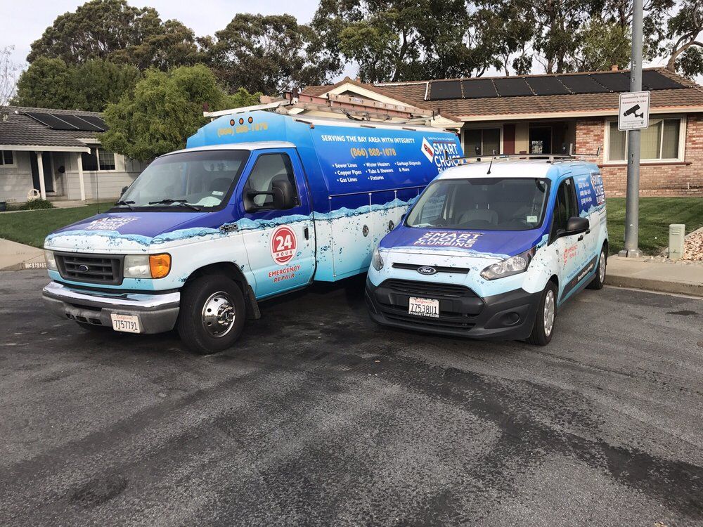 Smart Choice Plumbing truck and van parked outside a home in Castro Valley