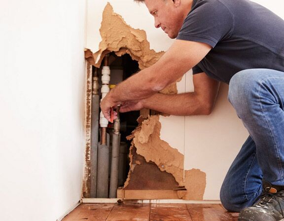 plumbing technician repipes a kitchen