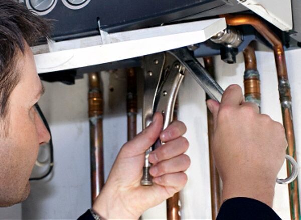 Jack is working on water heater repair